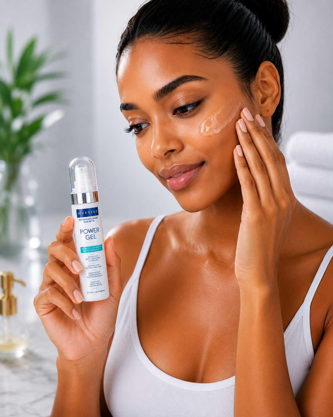 Person applying HueVine Power Gel resurfacing serum as part of a daily facial skincare routine.