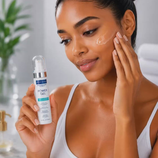 Person demonstrating application of HueVine Power Gel resurfacing serum with SPF 50 during a facial skincare routine.
